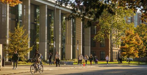 students outside building in fall